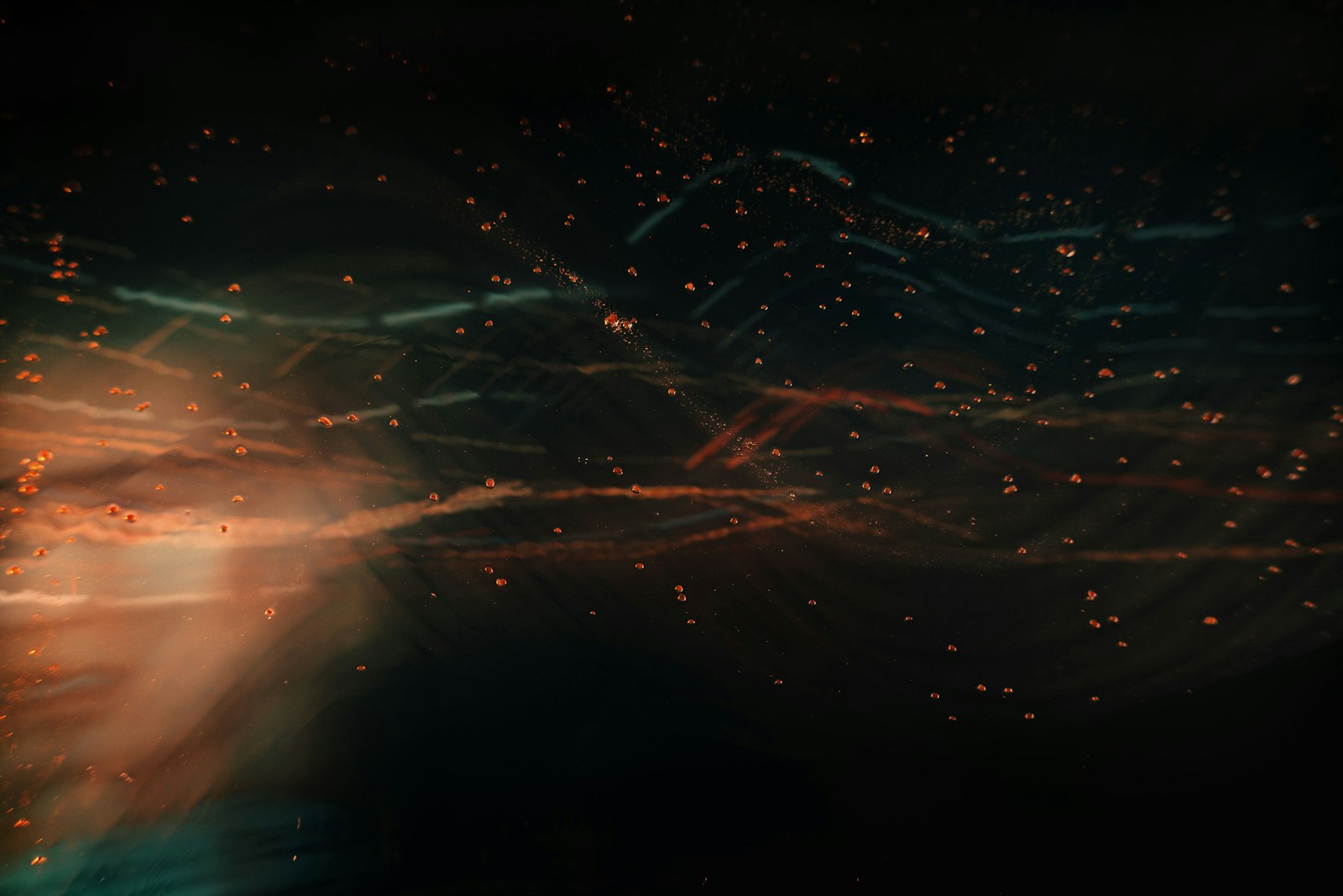 An abstract photograph of light streaking out in many directions, standing in for reality branching